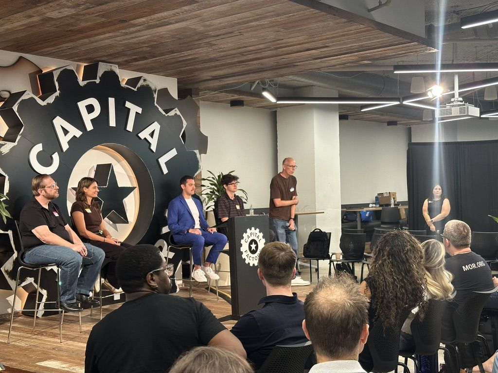 A panel discussion on stage at Capital Factory in Austin